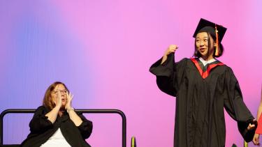 Principal cheering on graduating student